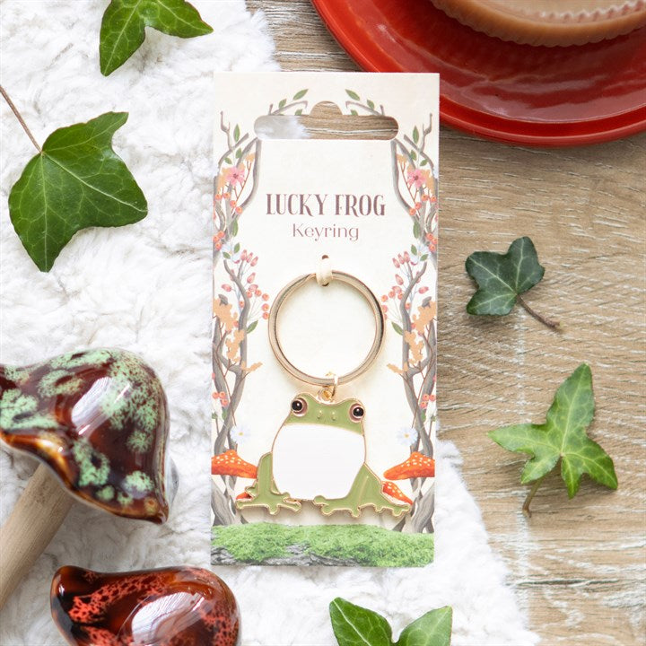 Lucky Frog keyring lifestyle shot on backing card with ivy leaves and ceramic frog ornament