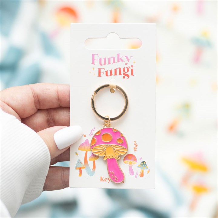 Funky Fungi mushroom keyring held in hand showing backing card lifestyle shot