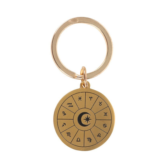 Gold-tone astrology wheel keyring charm close up showing all 12 zodiac symbols