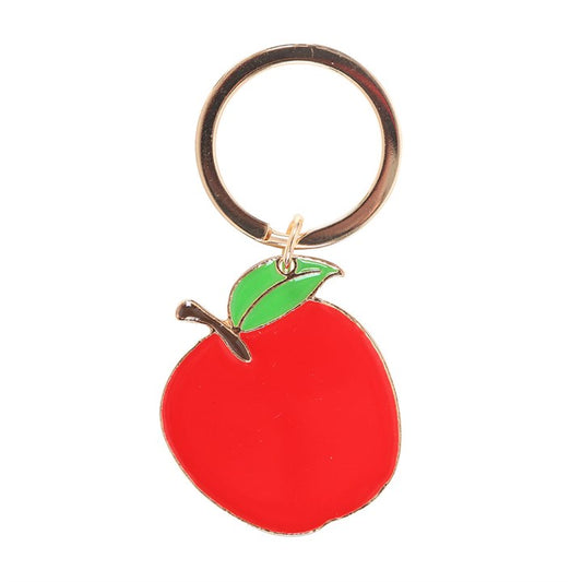 Best Teacher apple enamel keyring charm close up on white background showing red enamel apple with green leaf and gold detailing