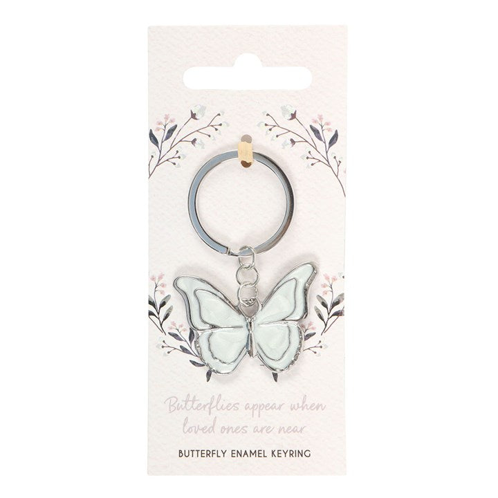 White butterfly enamel keyring on floral Butterflies Appear When Loved Ones Are Near backing card with white background