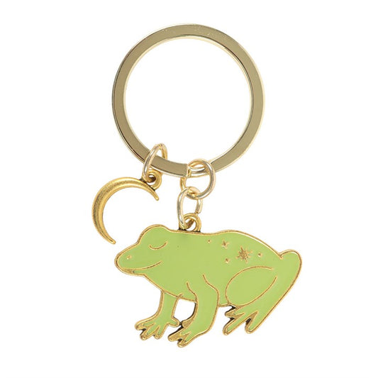 Luna Frog enamel keyring charm close up on white background showing sage green frog with gold star details and crescent moon charm