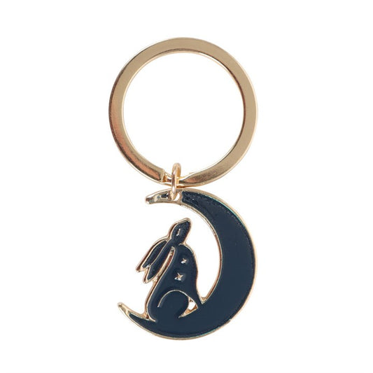 Midnight Hare enamel keyring charm close up on white background showing navy moon and hare silhouette