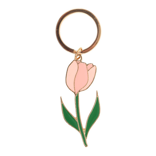 Pink tulip enamel keyring charm close up on white background showing blush petals and gold detailing