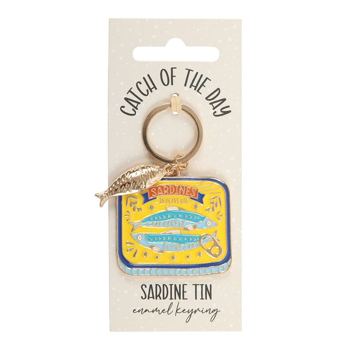 Sardine tin enamel keyring on cream Catch of the Day backing card with white background