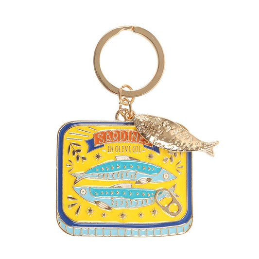 Sardine tin enamel keyring charm close up on white background showing yellow and blue tin with dangling gold sardine charm