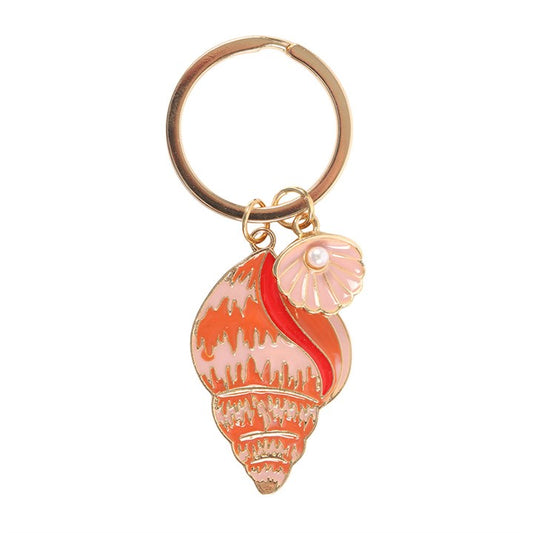 High Tide shell enamel keyring charm close up on white background showing coral conch shell with gold detailing and pearl oyster charm