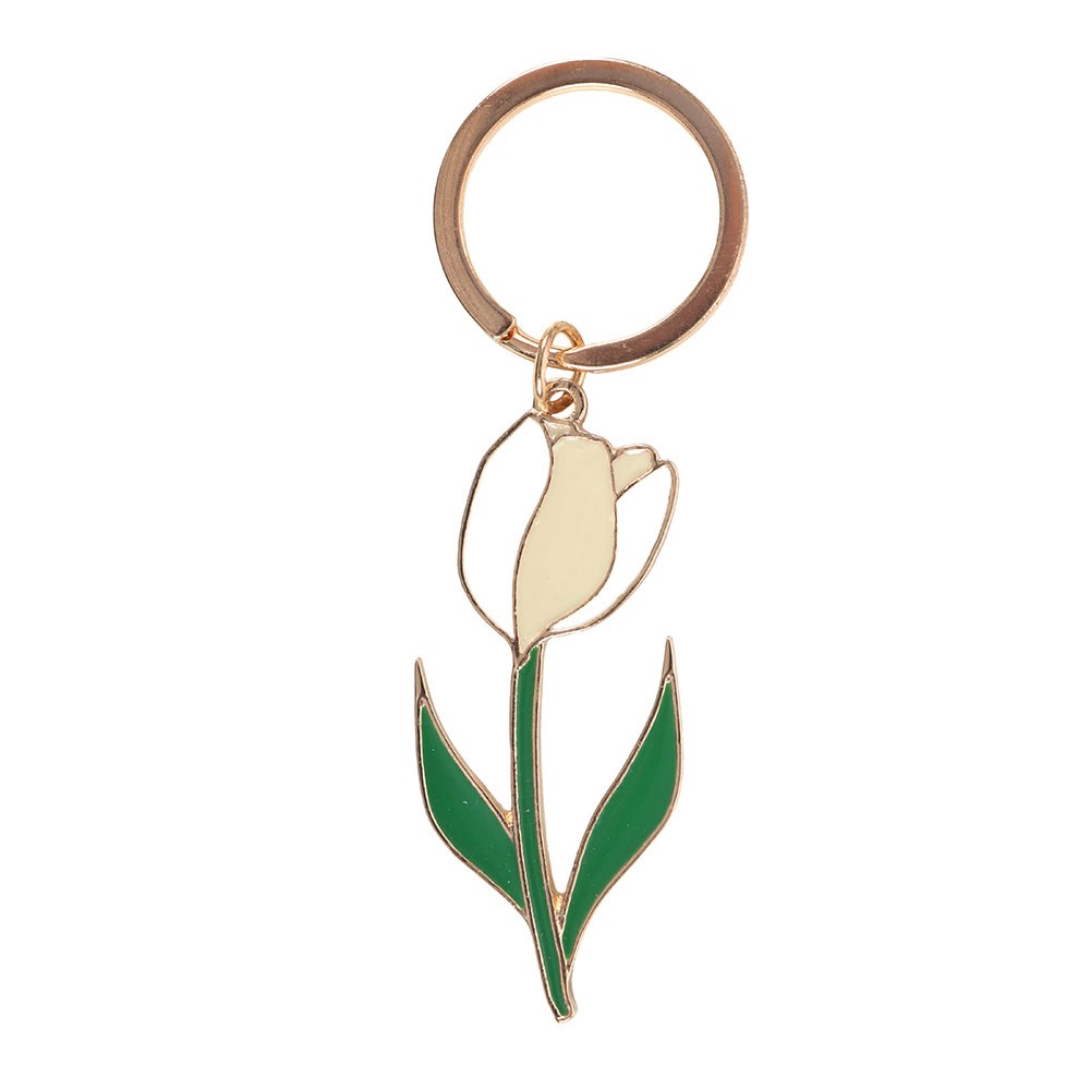 White tulip enamel keyring charm close up on white background showing green leaves and gold detailing
